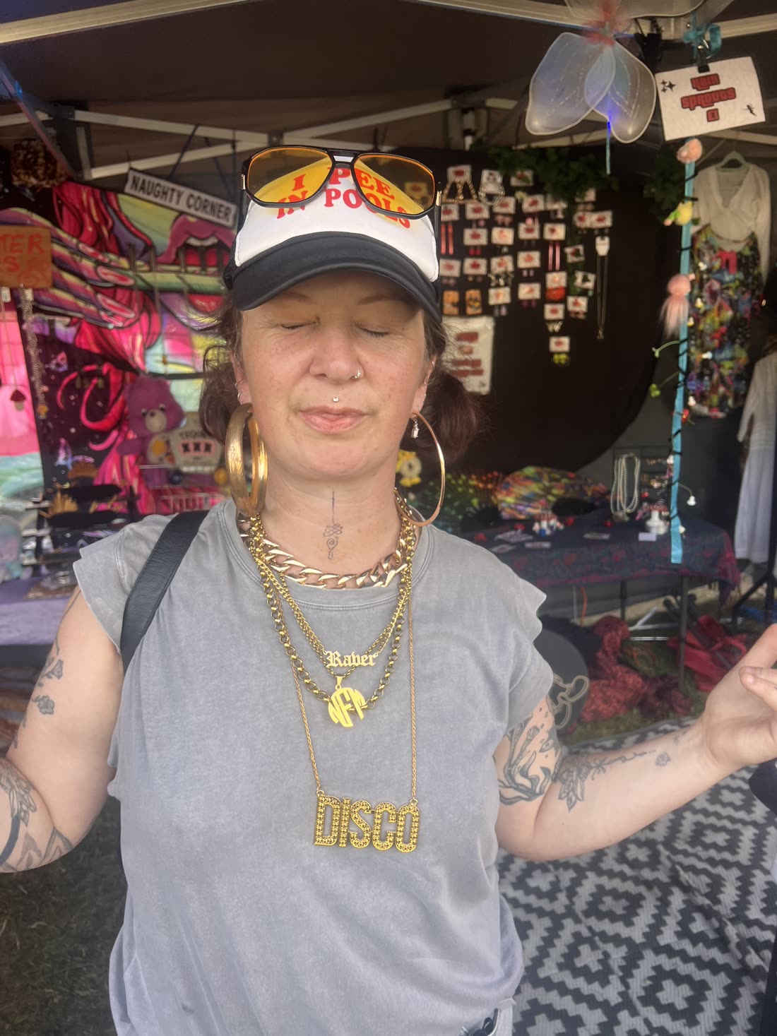 Festival-goer wearing gold statement jewellery at the Jewels Deep stall